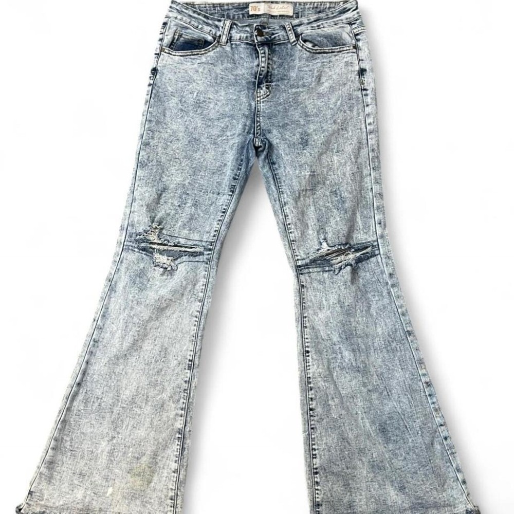 blue 70s style flare  jeans with a distressed look